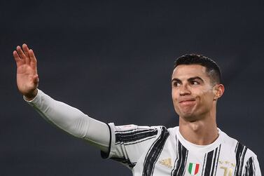 (FILES) In this file photo taken on February 09, 2021 Juventus' Portuguese forward Cristiano Ronaldo reacts during the Italian Cup semifinal second leg football match beetween Juventus Turin and Inter Milan on February 9, 2021 at the Juventus stadium in Turin.  - Manchester United completed the signing of Cristiano Ronaldo on August 31, 2021 for his second spell at Old Trafford for a fee that could rise to 23 million euros ($27 million) from Juventus.  The 36-year-old made his name on the world stage in six years at United between 2003 and 2009 before moving to Real Madrid for a then world record transfer fee.  Ronaldo scored 118 goals in 292 games during his first spell at United, winning his first Ballon d'Or and Champions League title, as well as three Premier League titles, one FA Cup and two League Cups.  (Photo by Marco BERTORELLO  /  AFP)