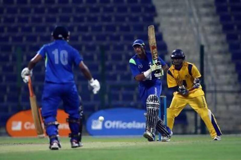 Shahzad Manna, of Yogi Group, plays a shot during the Ramadan Cup final match against Danube Lions at the Zayed Cricket Stadium in Abu Dhabi. The Lions defeated Yogi Group by six wickets.