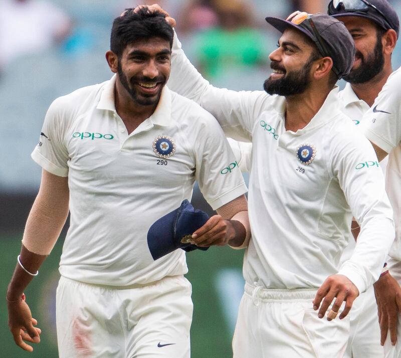 India's captain Virat Kohli, right, celebrates Jasprit Bumrah, left, after Bumrah got the wicket of Australia's Shaun Marsh during play on day three of the third cricket test between India and Australia in Melbourne, Australia, Friday, Dec. 28, 2018. (AP Photo/Asanka Brendon Ratnayake)