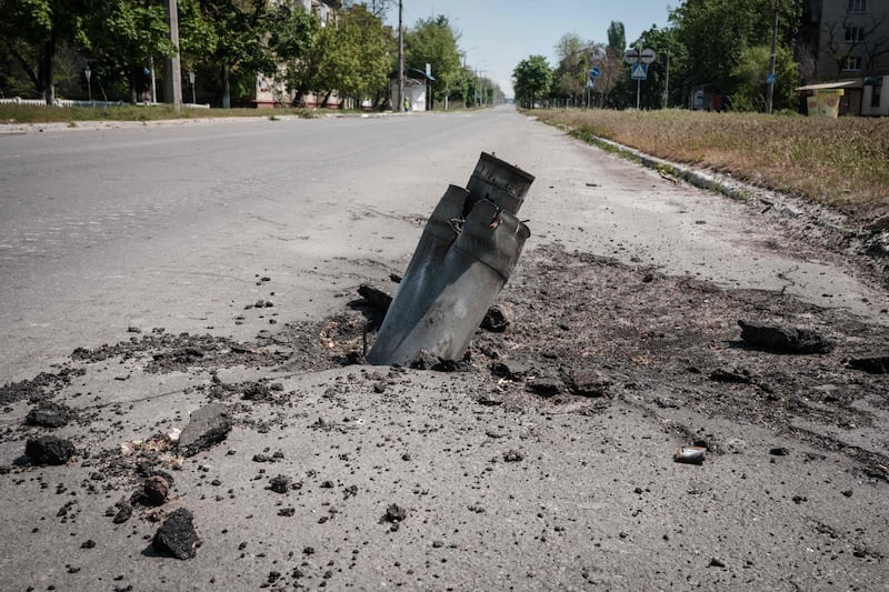 An unexploded ordnance on a road in Severodonetsk. AFP