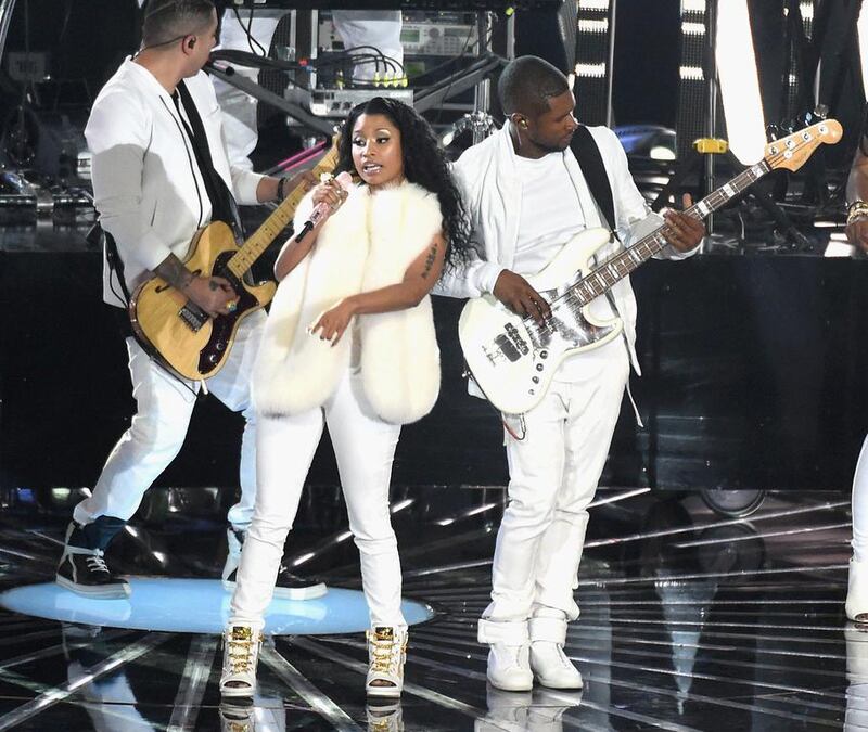 Recording artists Nicki Minaj, left, and Usher perform onstage during the 2014 MTV Video Music Awards. Michael Buckner / Getty Images / AFP