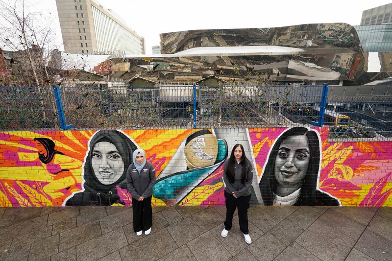 On Tuesday the official launch to find 2,022 baton bearers to take part in the Queen's Baton Relay across England for the Birmingham 2022 Commonwealth Games. Boxing coach Haseebah Abdullah and cricketer Salma Bi are pictured by a commemorative mural depicting themselves, designed by one of the UK's most prolific street artists, Gent 48. PA