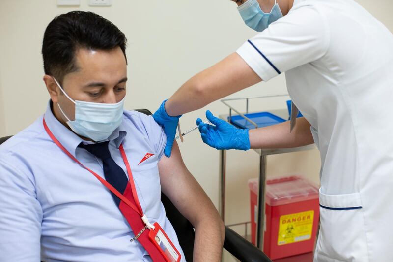 Asif Khan Fazle Subhan, a 37-year-old driver for Dubai's Roads and Transport Authority, is vaccinated against Covid-19