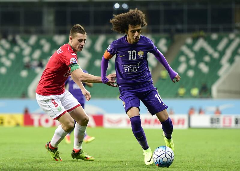 Al Ain's Omar Abdulrahman dribbles past a Lokomotiv defender. Courtesy / Al Ain Football Club