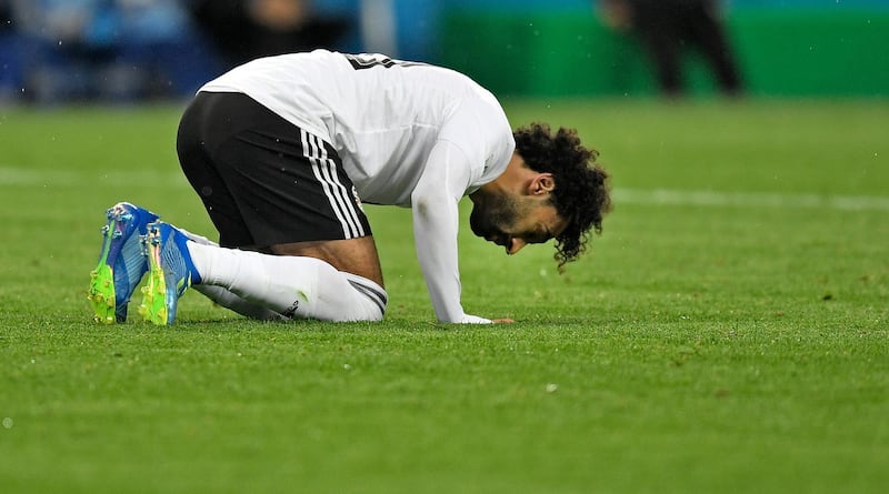 Egypt's Mohamed Salah prays on the ground after scoring a penalty during the group A match between Russia and Egypt. Martin Meissner / AP Photo