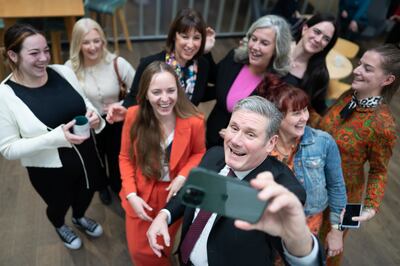 Keir Starmer and shadow chancellor Rachel Reeves with a group of women entrepreneurs at the Workshed Foundry in Swindon. PA