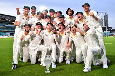 Australia's captain Tim Paine holds the Ashes Urn as the players celebrate victory after the presentation ceremony on the fourth day of the fifth Ashes cricket Test match between England and Australia at The Oval in London on September 15, 2019. England won the fifth test by 135 runs and drew the series but Australia keeps The Ashes trophy. - RESTRICTED TO EDITORIAL USE. NO ASSOCIATION WITH DIRECT COMPETITOR OF SPONSOR, PARTNER, OR SUPPLIER OF THE ECB / AFP / Glyn KIRK / RESTRICTED TO EDITORIAL USE. NO ASSOCIATION WITH DIRECT COMPETITOR OF SPONSOR, PARTNER, OR SUPPLIER OF THE ECB