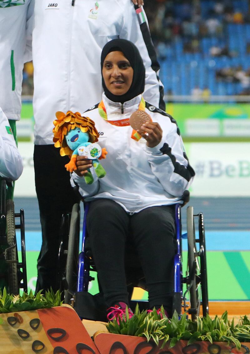 RIO DE JANEIRO, BRAZIL - SEPTEMBER 16:  (L_R) Silver medalist Sara Hamdi Masoud of Qatar, gold medalist Asmahan Boudjadar of Algeria and bronze medalist Sara Alsenaani of United Arab Emirates pose on the podium at the medal ceremony for Women's Shot Put - F33 during day 9 of the Rio 2016 Paralympic Games at the Olympic Stadium on September 16, 2016 in Rio de Janeiro, Brazil. (Photo by Lucas Uebel/Getty Images)