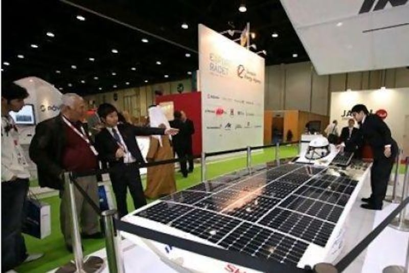 A solar car designed by students of Japan's Tokai University is displayed at the World Future Energy Summit in Abu Dhabi.