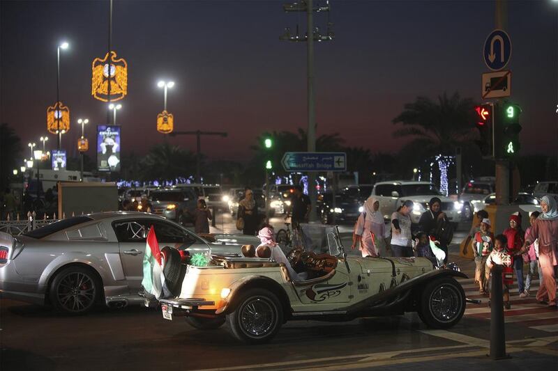 National Day celebrations kicked off on Abu Dhabi's Corniche with a very multi-national crowd. Lee Hoagland/The National 