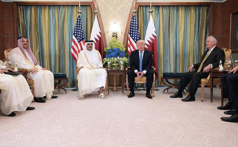 US president Donald Trump, centre right, and Qatar’s Emir Sheikh Tamim Bin Hamad Al-Thani, centre left, take part in a bilateral meeting at a hotel in Riyadh on May 21, 2017. Mandel Ngan / AFP