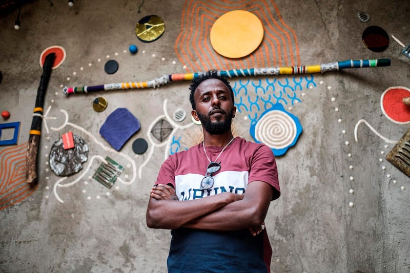 Eritrean painter Noah Mulubrhan, 35, is portrayed in local gallery in Addis Ababa. AFP