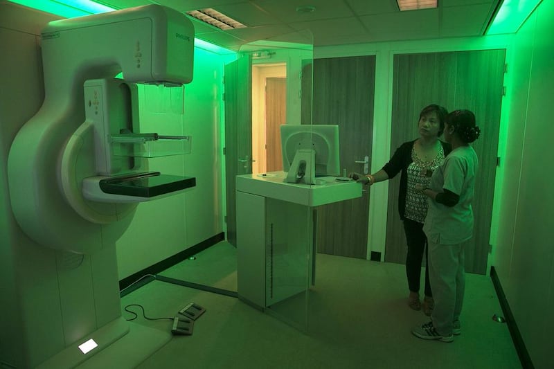 A walk-in client at a mobile mammogram clinic in Mussaffah, Abu Dhabi,  asks about procedure before screening begins. A leading radiologist in Sweden says the frontline against breast cancer needs professionals aware of the disease’s nuances. Silvia Razgova / The National