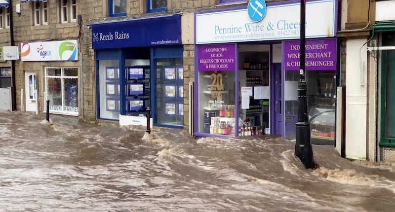 A flooded street is seen after Storm Ciara downpour in Hebden Bridge, West Yorkshire, Britain. REUTERS