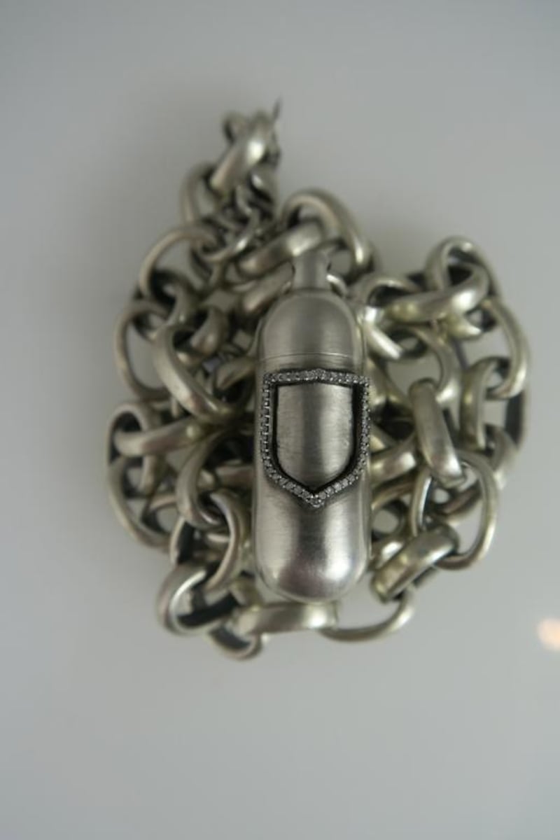 Jade Jagger’s Insignia silver charm necklace has a bullet pendant hanging from its centre. Look a little closer and you will see that there is a lid that unscrews to reveal a secret compartment. Inspired by traditional Indian prayer boxes, it acts as a container for cherished personal items. Courtesy Jade Jagger / The House of Luxury