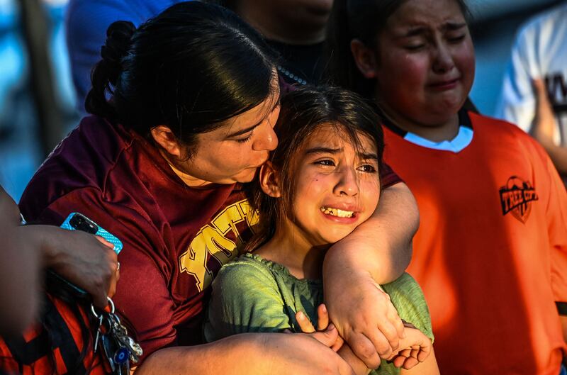 Texas police faced angry questions over why it took an hour to stop the gunman who murdered 19 children and two teachers in Uvalde, as video emerged of desperate parents begging officers to storm the school.  AFP