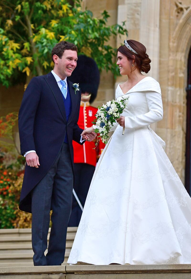 Princess Eugenie and her new husband Jack Brooksbank outside St George's Chapel in Windsor Castle following their wedding, Britain October 12, 2018.  Victoria Jones/Pool via REUTERS