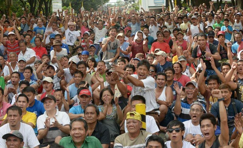 Filipinos gathered in a square in Manila to watch the match and celebrate Pacquiao's victory. Jay Directo / AFP