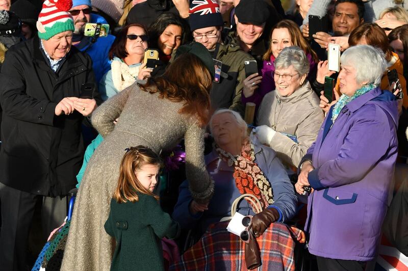 Britain's Catherine, Duchess of Cambridge, left, and Britain's Princess Charlotte of Cambridge greet well-wishers as they leave leave after the Royal Family's traditional Christmas Day service at St Mary Magdalene Church in Sandringham. AFP