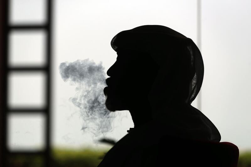 Ras Al Khaimah, United Arab Emirates - Reporter: Salem Al Ali smokes shisha at Orkied Cafe. Shisha cafes are now opening in RAK. Thursday, August 6th, 2020. Ras Al Khaimah. Chris Whiteoak / The National