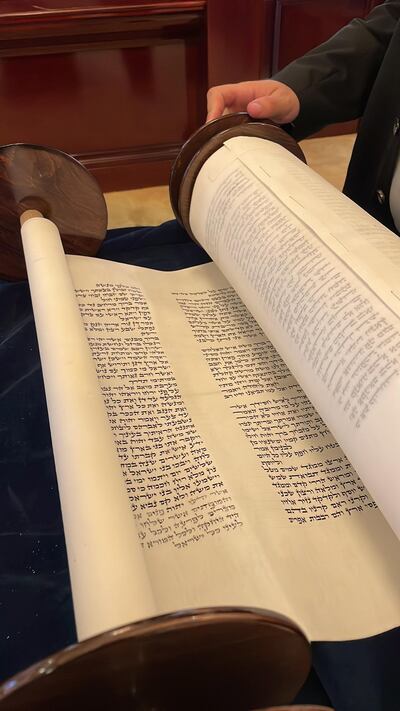 For a year, a specially trained pious scribe, called a Sofer Setam, has been writing the script for the scroll, which comprises the five books of the written Torah in Hebrew.
