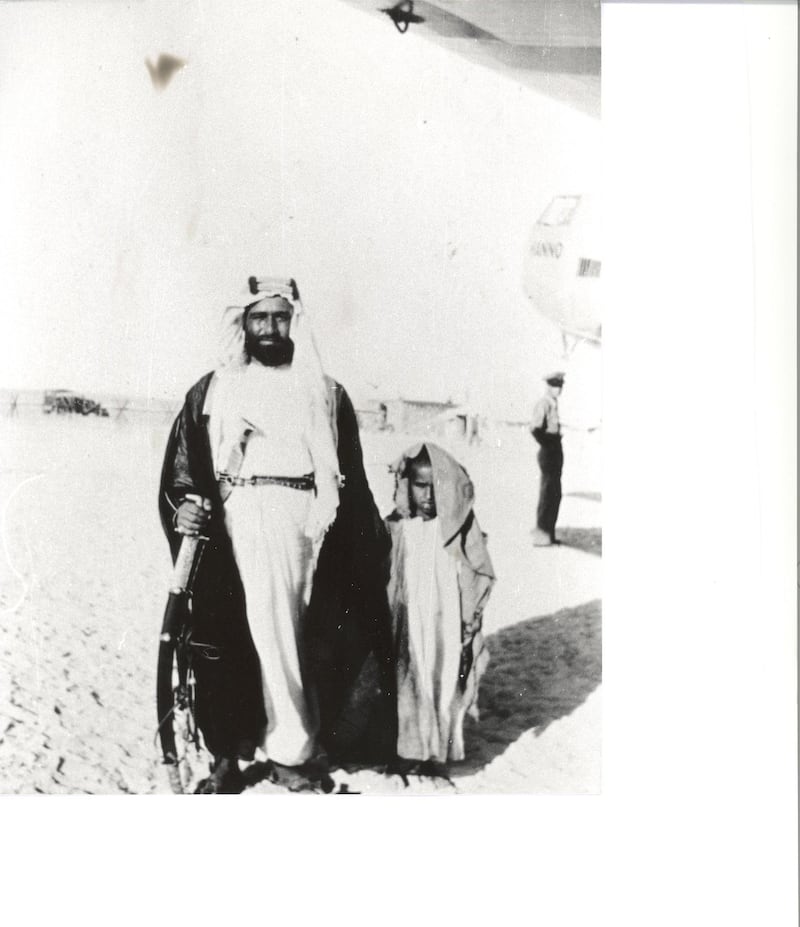 Sheikh Sultan bin Saqr Al Qasimi stands under one of the wings of the Hanno after the plane made its arrival.