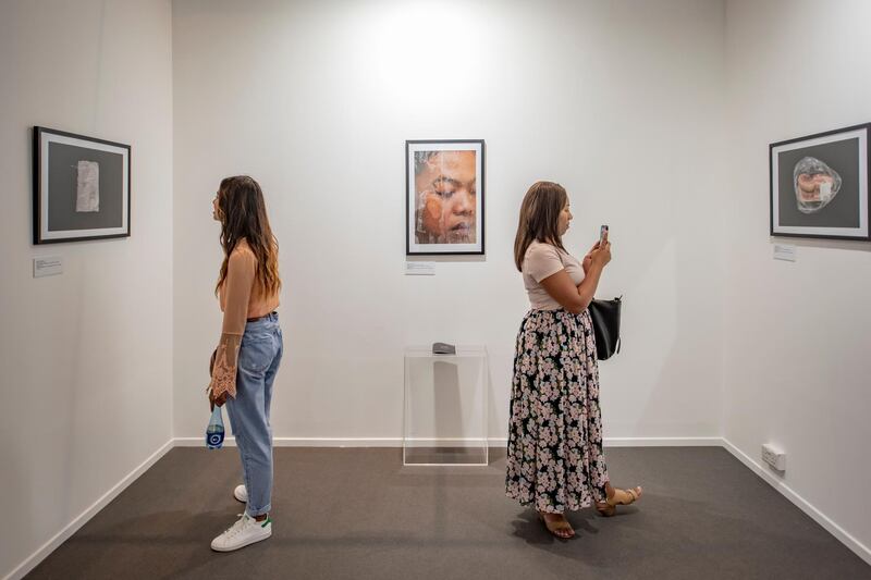 Visitors at the Campus Art Dubai exhibition during Art Dubai 2019. Photo Solutions