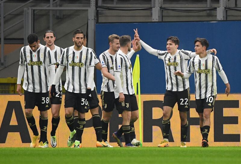 Juventus' Federico Chiesa celebrates scoring their first goal at the San Siro. Reuters