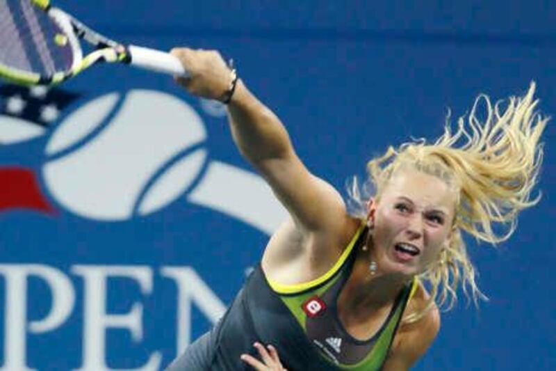 Caroline Wozniacki of Denmark serves against Chelsey Gullickson during the first round at the U.S. Open tennis tournament in New York, early Wednesday, Sept. 1, 2010. (AP Photo/Charles Krupa)
