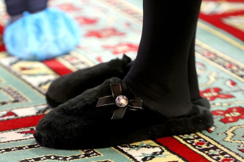 A close up of the faux-fur Pour Moi slippers worn by the Duchess of Cornwall, worth $26. AFP