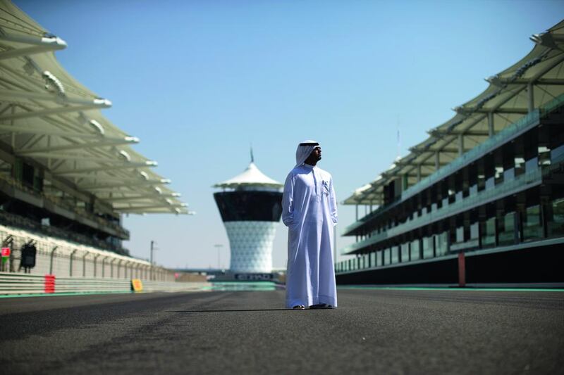 Ahmed Hilal Al Kaabi, the Yas Marina Circuit’s head of Government affairs, surveys the track ahead of this weekend’s Abu Dhabi Grand Prix, which requires a team of hundreds of staff to successfully operate. Christopher Pike / The National
