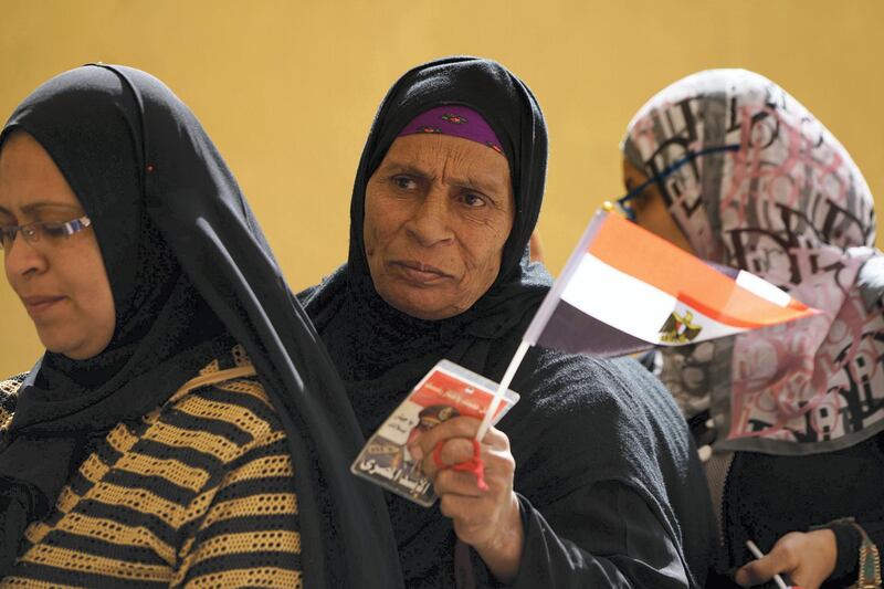 March 26, 2018- Cairo-- A woman stands in line to vote in the Gamiliya district in Cairo. Monday is the first day of voting in Egypt's presidential election. (Dana Smillie for The National)