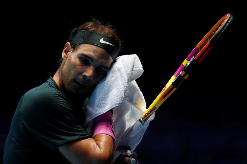 Rafael Nadal towels down in between points. Reuters