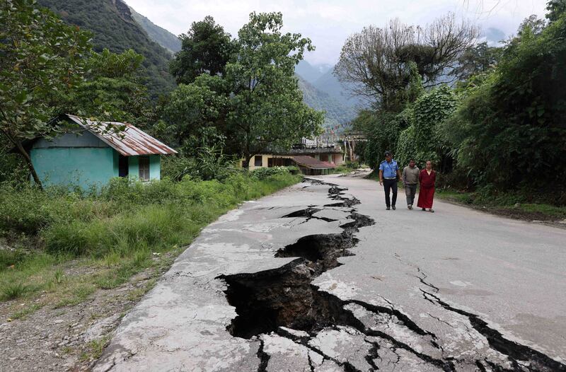 Cracks in the road caused by flash floods in Naga-Namgor village, Sikkim, India. Reuters