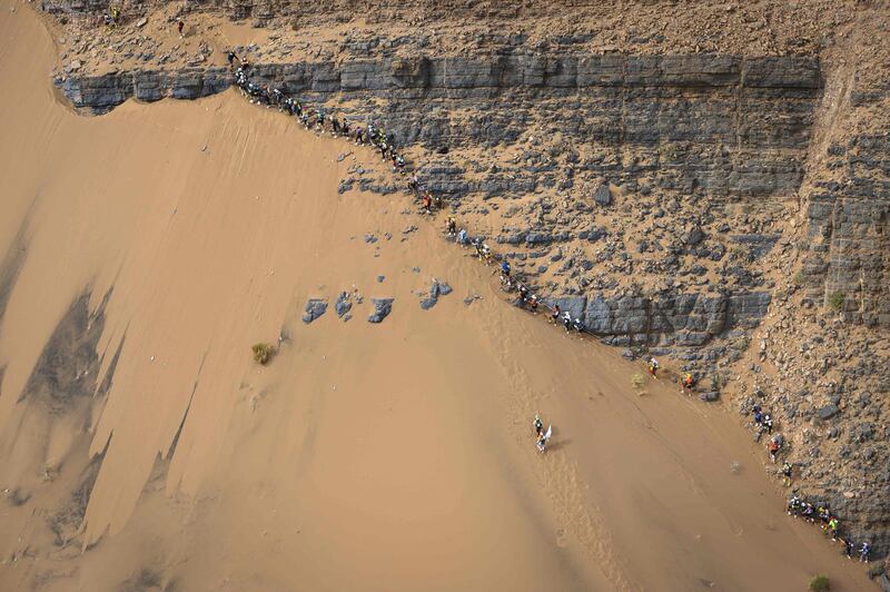 People compete in the stage 5 of the 34rd edition of the Marathon des Sables between El Borouj and Tisserdimine in the southern Moroccan Sahara desert, on April 12, 2019. The 34rd edition of the marathon is a live stage 250 kilometres race through a formidable landscape in one of the world's most inhospitable climates.  AFP