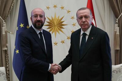 A handout picture taken and released by the Turkish presidential press office shows Turkey's President Recep Tayyip Erdogan (R) shaking hands with European Council’s President Charles Michel (L) at the Presidential Complex in Ankara, on March 4, 2020. EU foreign policy chief Josep Borrell and Council President Charles Michel met with Erdogan and other top officials in Ankara on Wednesday, promising an additional 170 million euros ($189 million) in aid for vulnerable groups in Syria.  - RESTRICTED TO EDITORIAL USE - MANDATORY CREDIT "AFP PHOTO / TURKISH PRESIDENTIAL PRESS SERVICE / MURAT CETINMUHURDAR " - NO MARKETING NO ADVERTISING CAMPAIGNS - DISTRIBUTED AS A SERVICE TO CLIENTS
 / AFP / TURKISH PRESIDENTIAL PRESS SERVICE / Murat CETINMUHURDAR / RESTRICTED TO EDITORIAL USE - MANDATORY CREDIT "AFP PHOTO / TURKISH PRESIDENTIAL PRESS SERVICE / MURAT CETINMUHURDAR " - NO MARKETING NO ADVERTISING CAMPAIGNS - DISTRIBUTED AS A SERVICE TO CLIENTS
