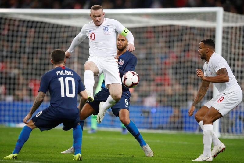 England's Wayne Rooney in action with John Brooks and Christian Pulisic of the U.S. Reuters