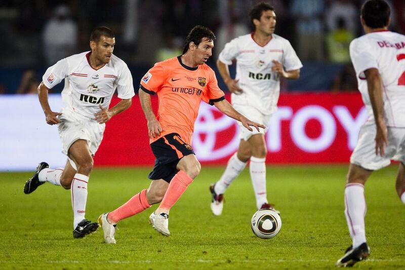 Lionel Messi, centre, was the main draw at the Fifa Club World Cup at Zayed Sports City in 2009. Andrew Henderson For The National