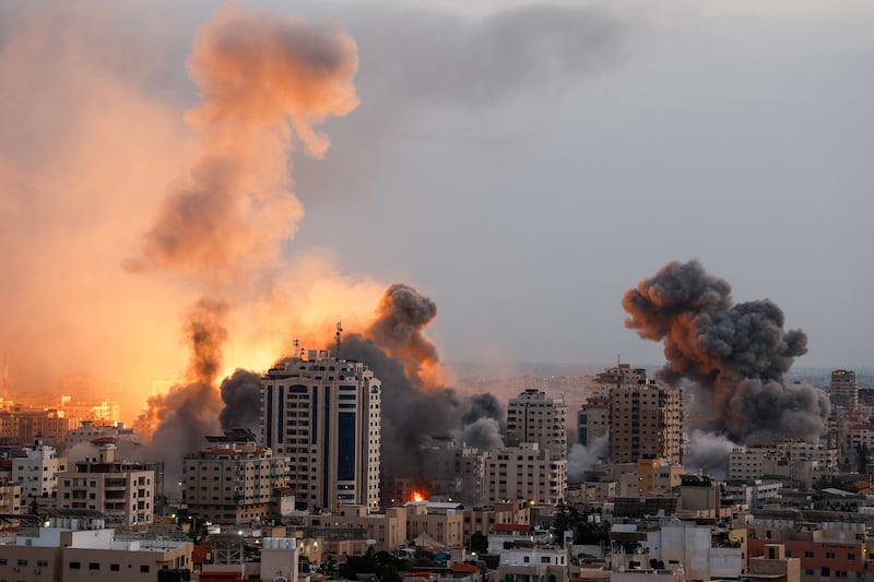 Smoke and flames rise following Israeli strikes in Gaza. Reuters