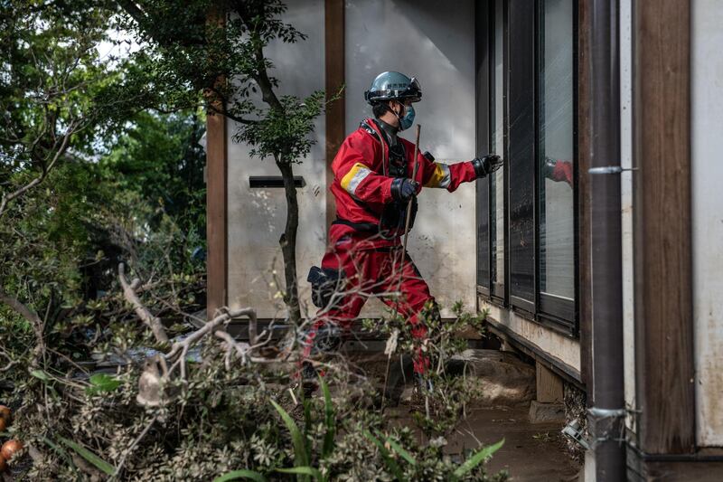 A rescue worker checks a property after heavy flooding caused by Typhoon Hagibis in Hoyasu near Nagano, Japan. Japan has mobilised over 100,000 rescue workers after Typhoon Hagibis, the most powerful storm in decades, swept across the country killing 66 people and leaving thousands injured and homeless. Getty Images