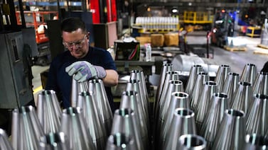 An employee handles 155mm shells at the Scranton Army Ammunition Plant in Pennsylvania on April 16. AFP