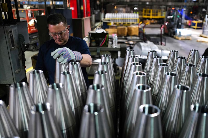 An employee handles 155mm shells at the Scranton Army Ammunition Plant in Pennsylvania on April 16. AFP
