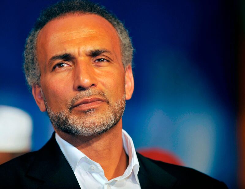 (FILES) This file photo taken on August 26, 2011 shows Swiss Islamologist Tariq Ramadan giving a speech at the Treichville sports parc, a popular district of Abijdan, during a conference "Night Destiny (Muslim feast known as Laylat al-Qadr), Night of Peace and Reconciliation".
Tariq Ramadan is currently under investigation in Paris for alleged "rape, sexual assault, violence and death threats", and is the subject of complaints by two women, including Henda Ayari, who make similar accusations. / AFP PHOTO / SIA KAMBOU