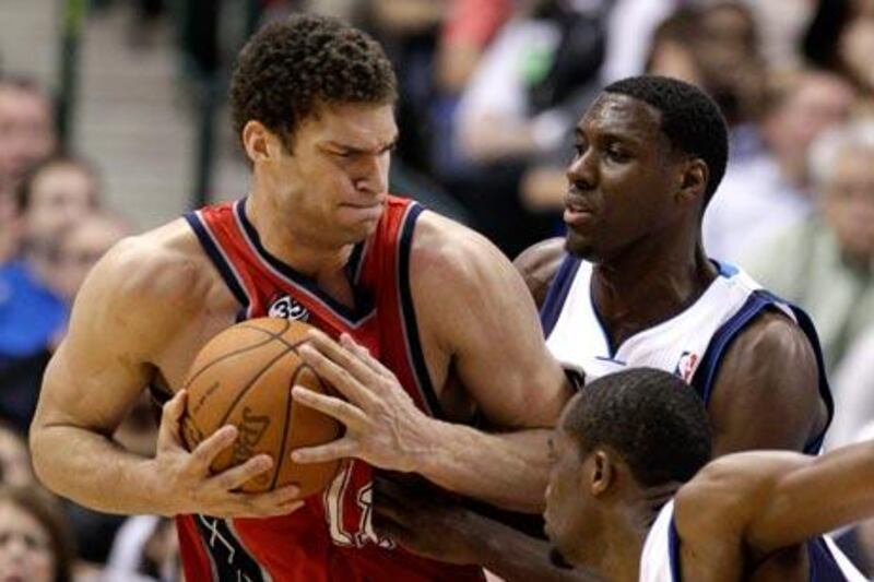 New Jersey Nets' Brook Lopez, left, scored 38 points against the Dallas Mavericks.