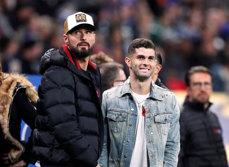 Olivier Giroud and Christian Pulisic during the NFL International Series at the Wembley Stadium. Reuters