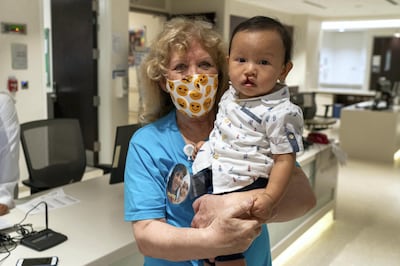 Morag Cromey-Hawke, executive director of Operation Smile UAE, with a young patient. Courtesy Operation Smile