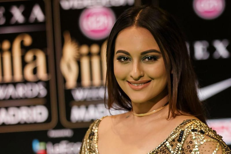 Indian Bollywood actress Sonakshi Sinha poses on the green carpet as she arrives to the 17th edition of IIFA Awards (International Indian Film Academy Awards) in Madrid on June 24, 2016. AFP / CESAR MANSO