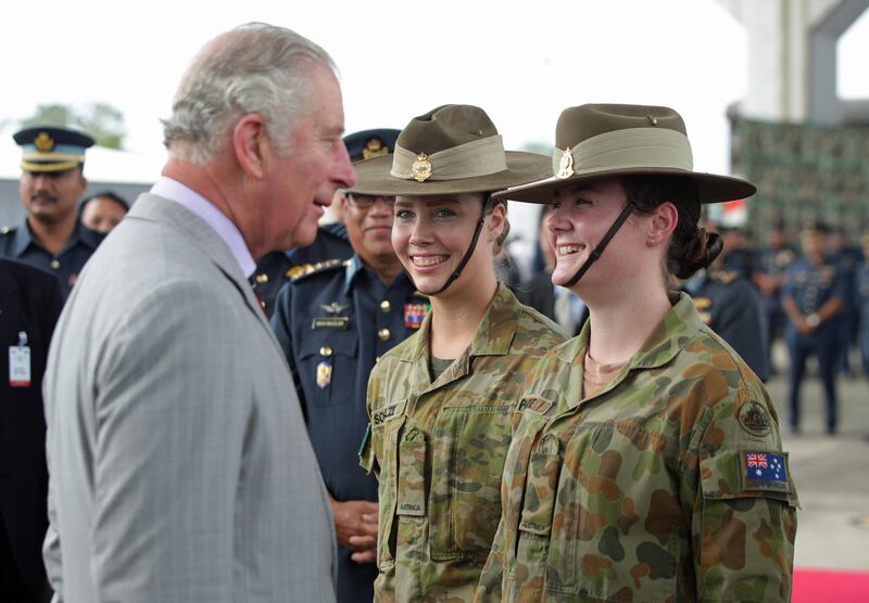 PENANG, MALAYSIA - NOVEMBER 07: Prince Charles, Prince of Wales meets Private Brydie Schultz (L) and Private Rachel Parise of the 19th Squadron of the Royal Australian Air Force, during a visit to Royal Malaysia Armed Forces Butterworth base on November 7, 2017 in Penang, Malaysia. Prince Charles, Prince of Wales and Camilla, Duchess of Cornwall are on a tour of Singapore, Malaysia, Brunei and India.  (Photo by Yui Mok - Pool / Getty Images)
