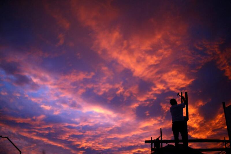 A man at work during sunset in Santiago, Chile. Ivan Alvarado / Reuters