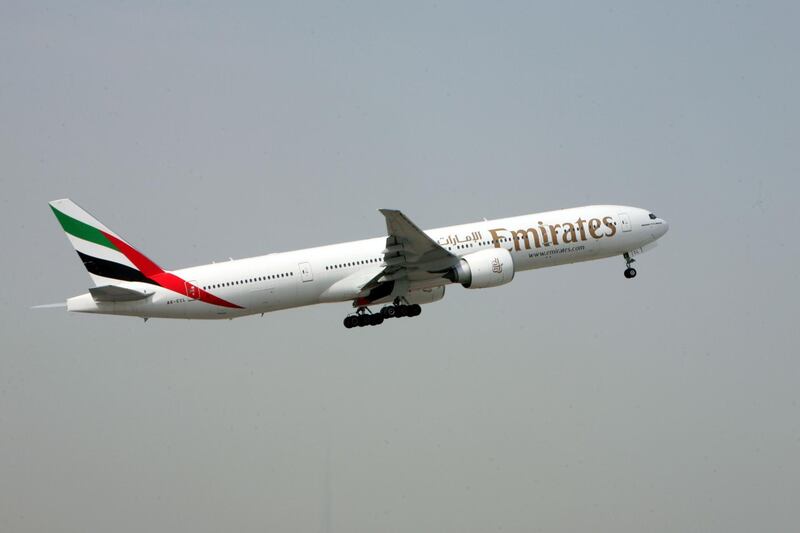 DUBAI, UNITED ARAB EMIRATES - AUGUST 9:  An Emirates plane takes off from Terminal 2 of the Dubai International airport in Dubai on August 9, 2009.  (Randi Sokoloff / The National)  For Stock. *** Local Caption ***  RS010-080909-EMIRATES.jpg